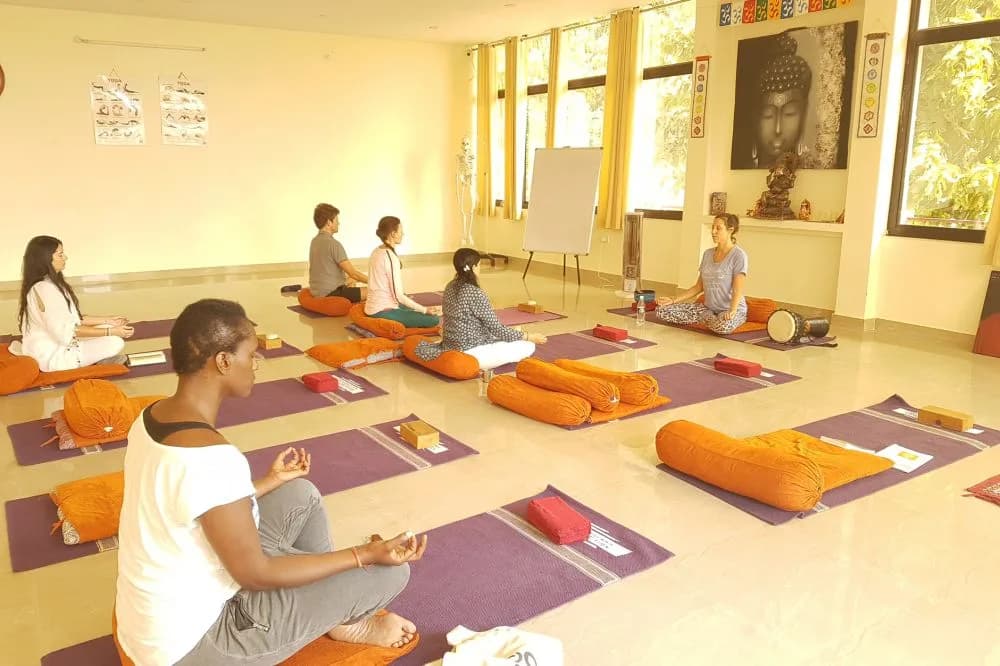 Deep Yoga retreat in Rishikesh — moment 1 from a past cohort on the banks of the Ganges